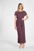 Woman modeling a short sleeve purple pleated dress with a tassel around the waist on a white background