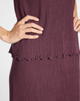 Close up photo of pleated purple silk fabric