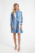Woman wearing a blue and white striped dress on a white background