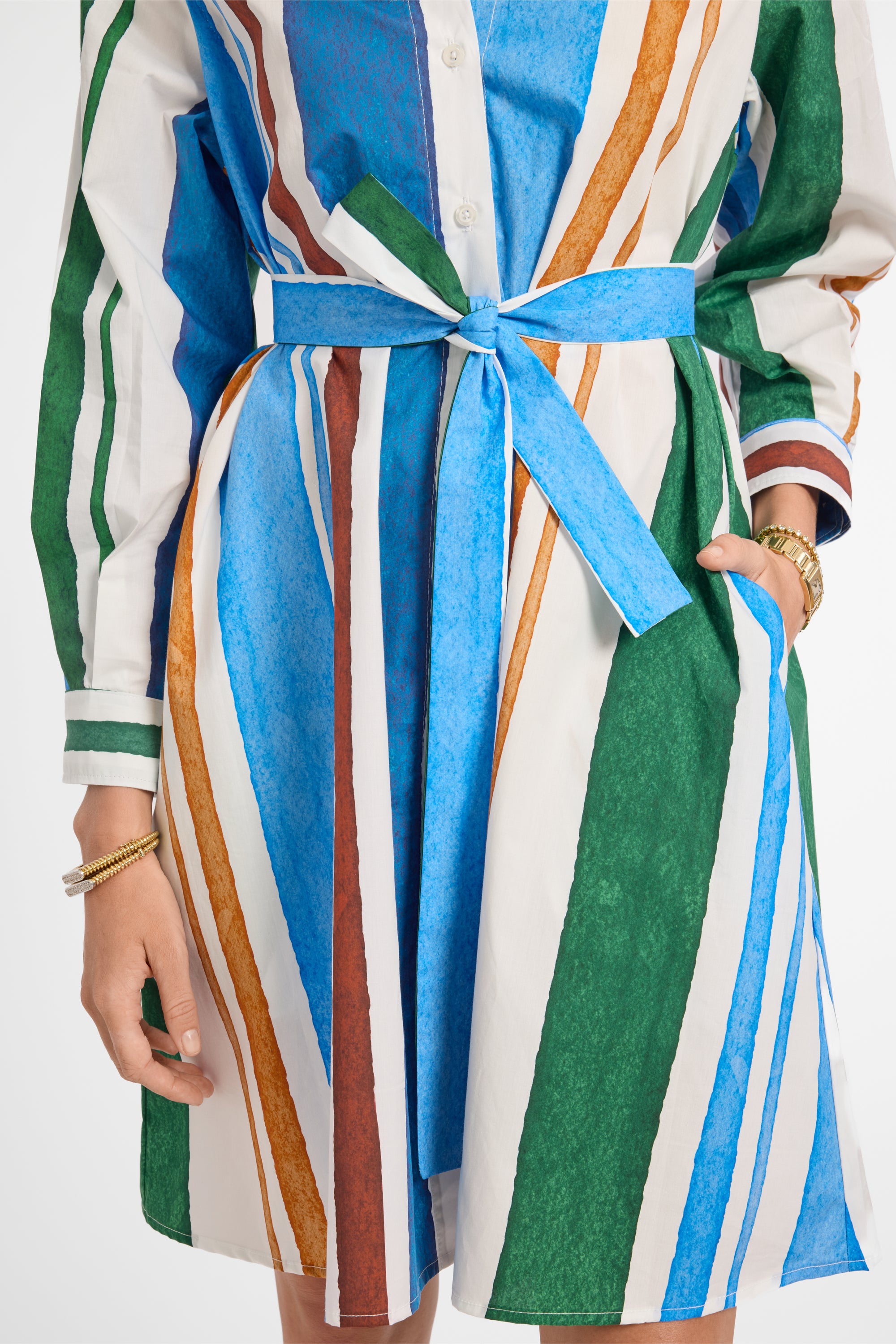 Colorful striped dress with a belt on a white background