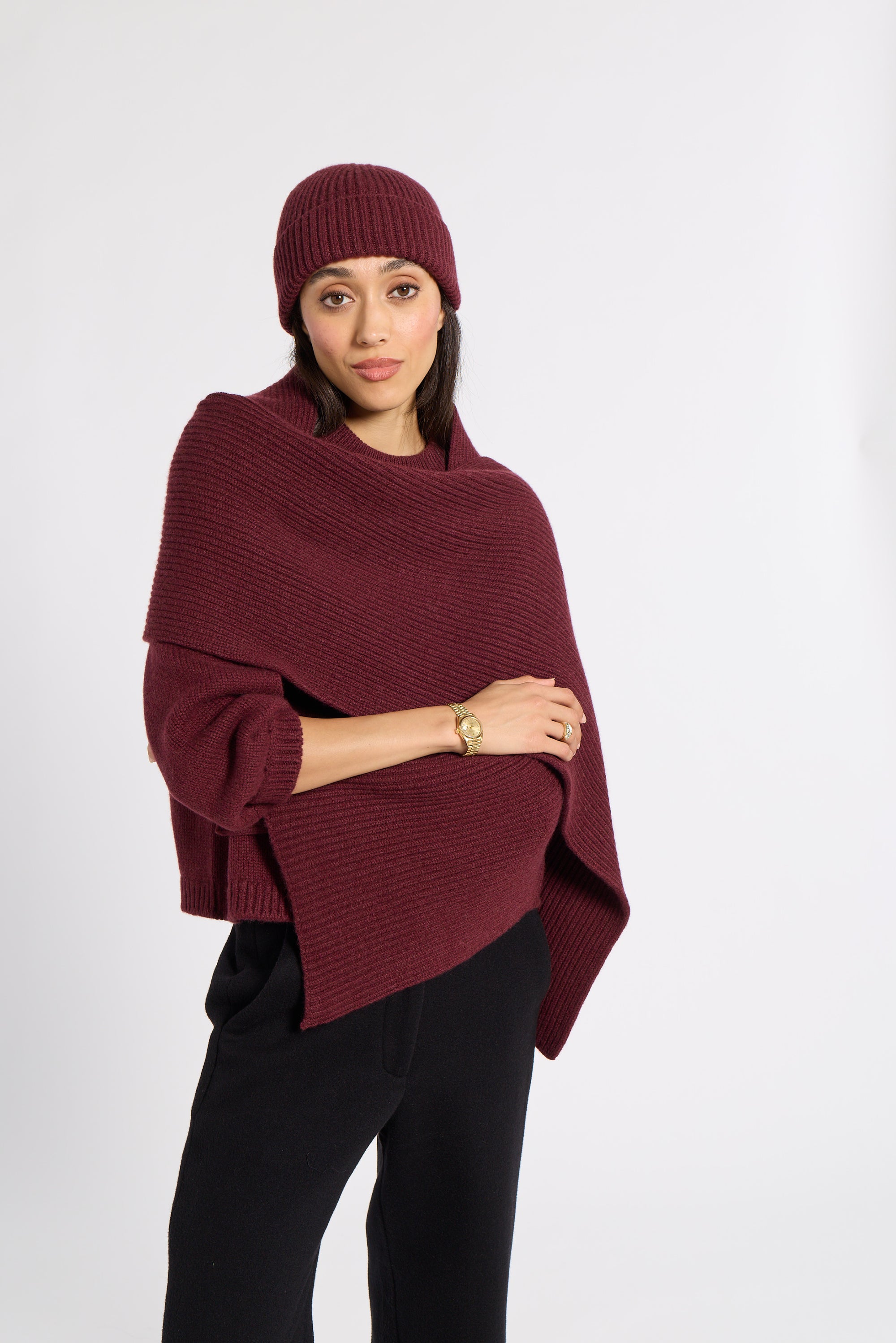 Woman wearing a burgundy cashmere scarf in a studio