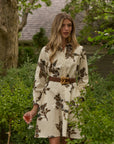 Woman wearing a long sleeve dress in an outdoor setting