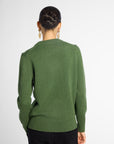Back view: Woman wearing Forest Green crewneck sweater in front of white background. 