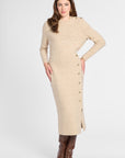 A woman modeling a beige knit long-sleeve midi dress with decorative buttons down the side, paired with brown knee-high boots, against a light gray studio background.