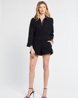 Woman wearing black lace shorts with a white background