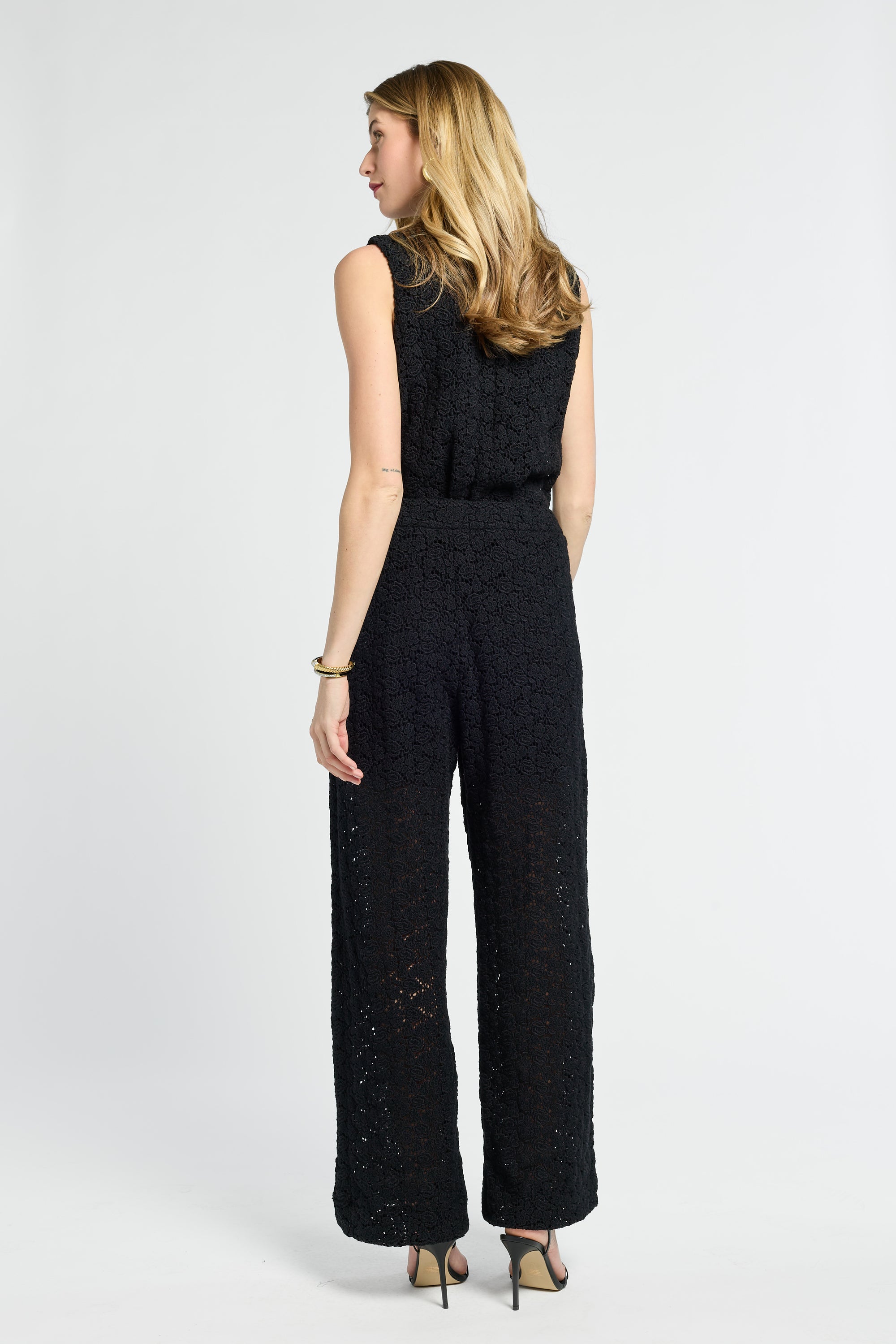 Woman wearing a black pants on a white background