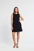 Woman wearing a black sleeveless dress on a white background