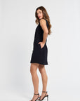 Woman wearing a black dress on a white background