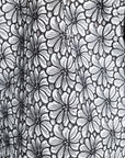 Black and white floral pattern on an article of clothing
