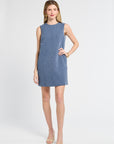 Woman wearing a blue floral mini dress on a white background