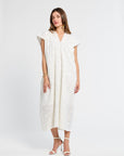 Woman wearing a white dress on a white background