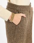 Close-up of the waistband, pocket, and brown woven texture of the Tobacco Tweed Ellis Pants, photographed against a plain white studio background.