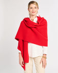 Woman wearing a red scarf on a white background