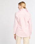 Person wearing a pink striped shirt on a white background