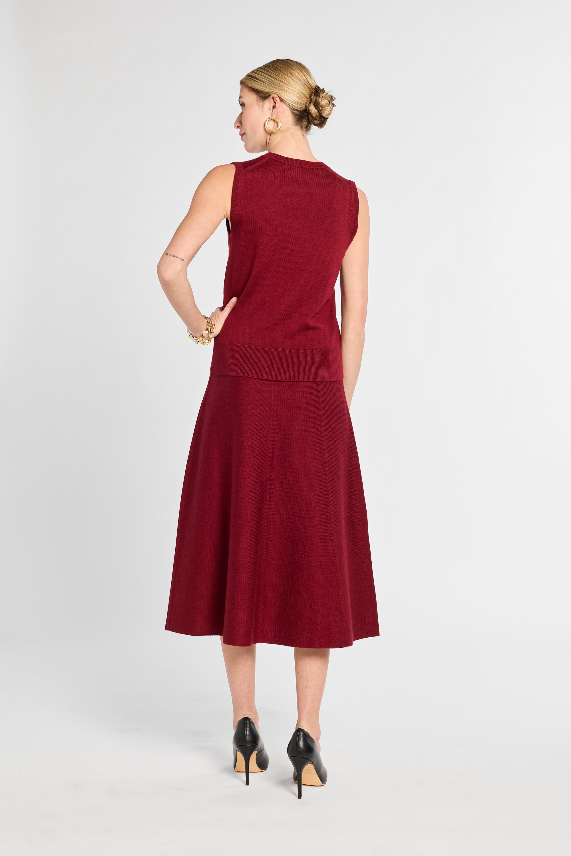 Woman wearing a red dress on a white background