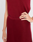 Red dress worn by a person on a white background
