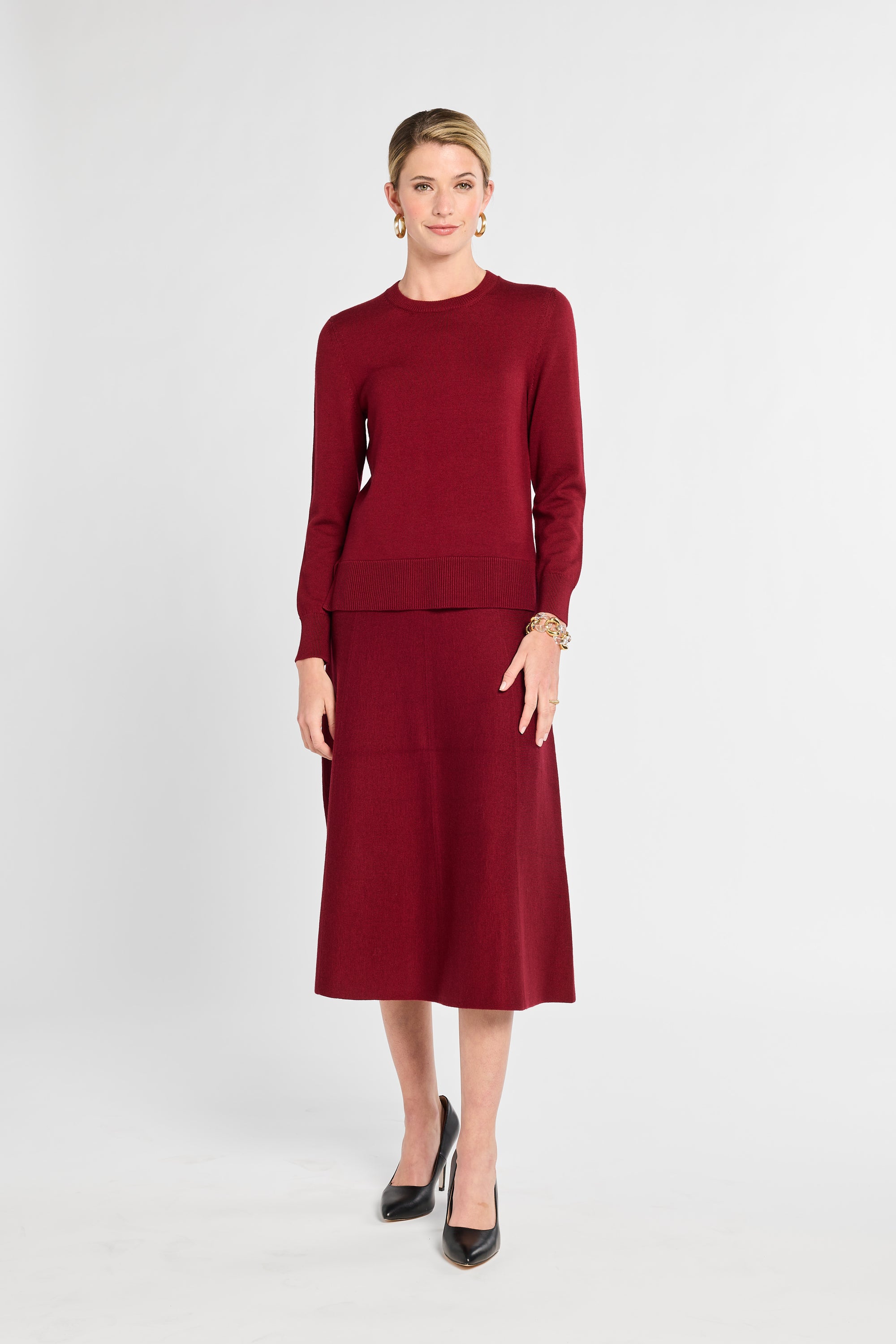 Woman wearing a red outfit on a white background