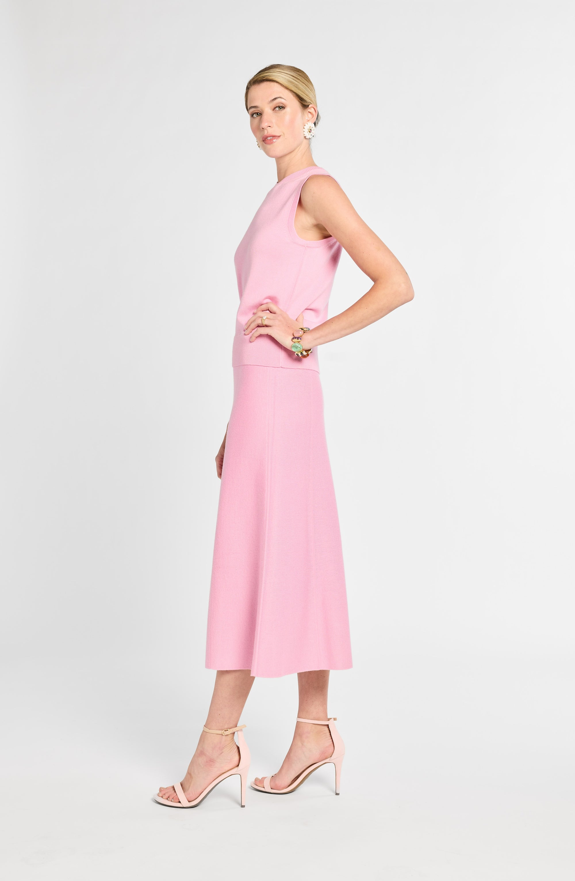Woman wearing a pink dress on a white background