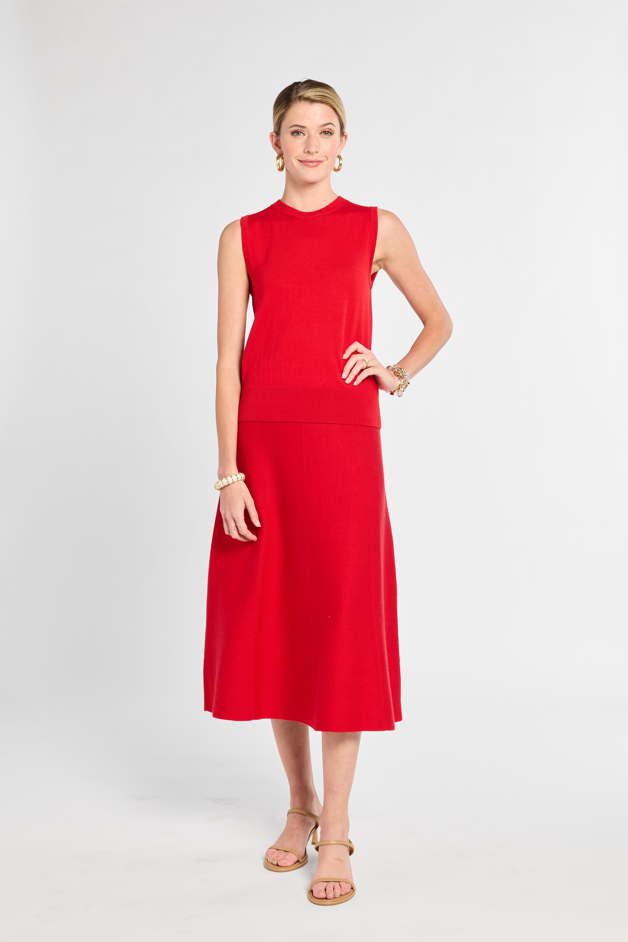 Woman wearing a red dress on a white background