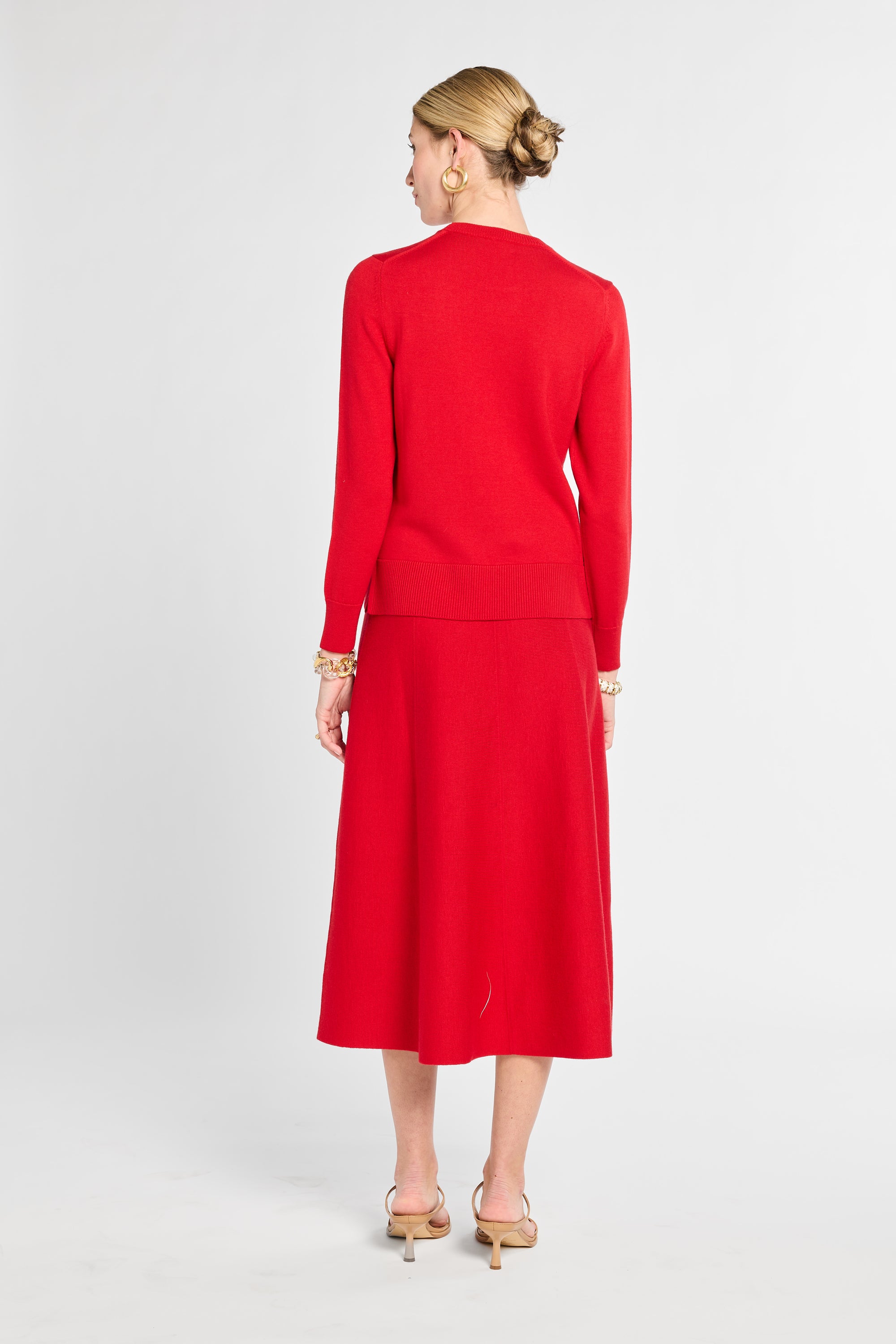 Woman wearing a red outfit on a white background