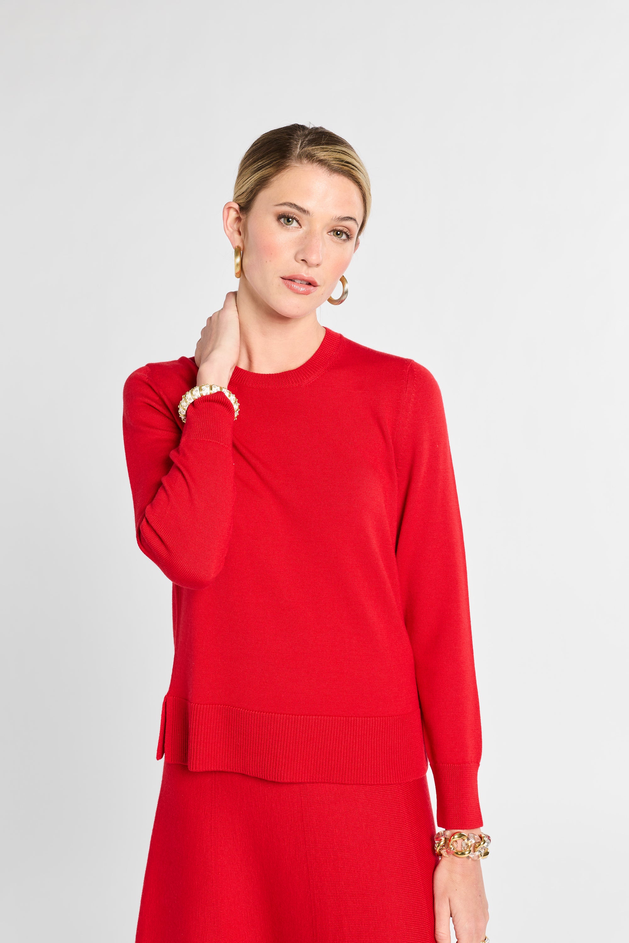 Woman wearing a red dress against a white background