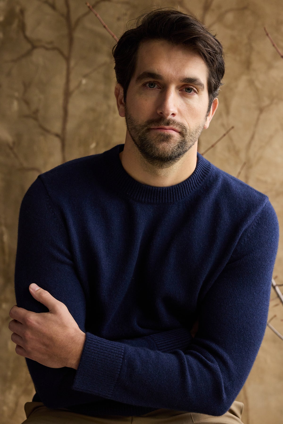 man wearing a navy cashmere sweater