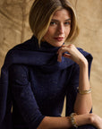 Woman with a cashmere wrap around her blue cashmere dress