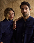 Woman and man standing together in blue cashmere outfits