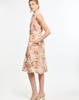 Woman wearing a floral dress on a white background