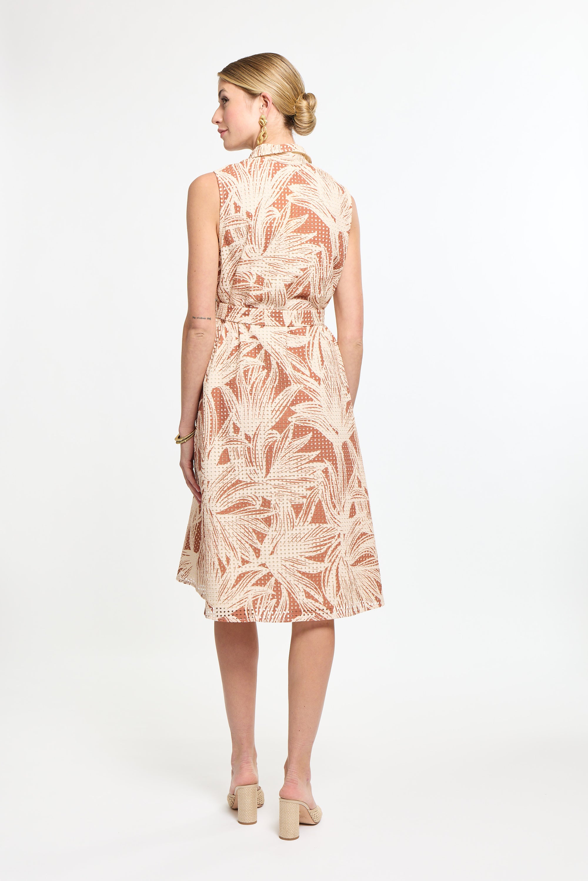 Woman wearing a floral dress on a white background