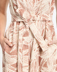 Close-up of a patterned dress with a belt