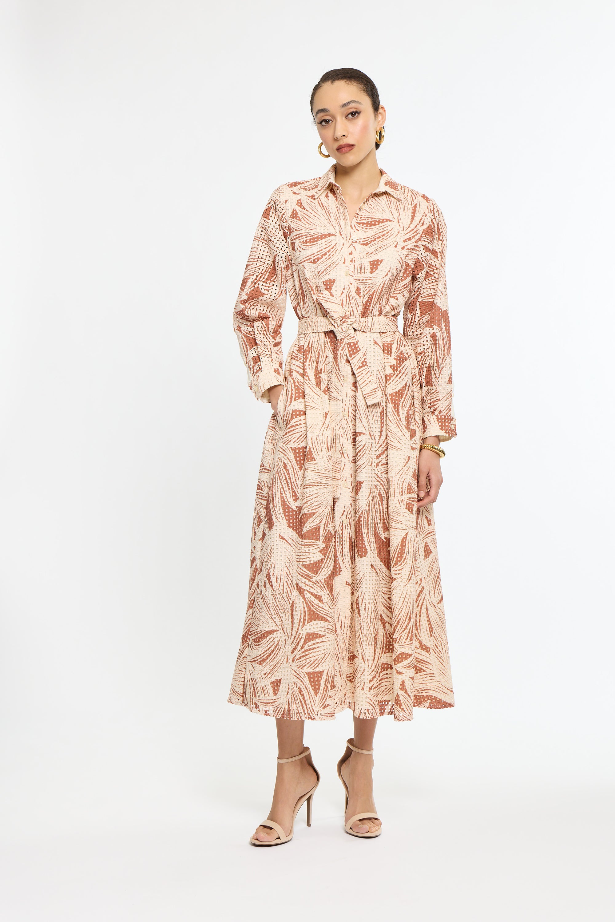 Woman wearing a floral dress on a white background