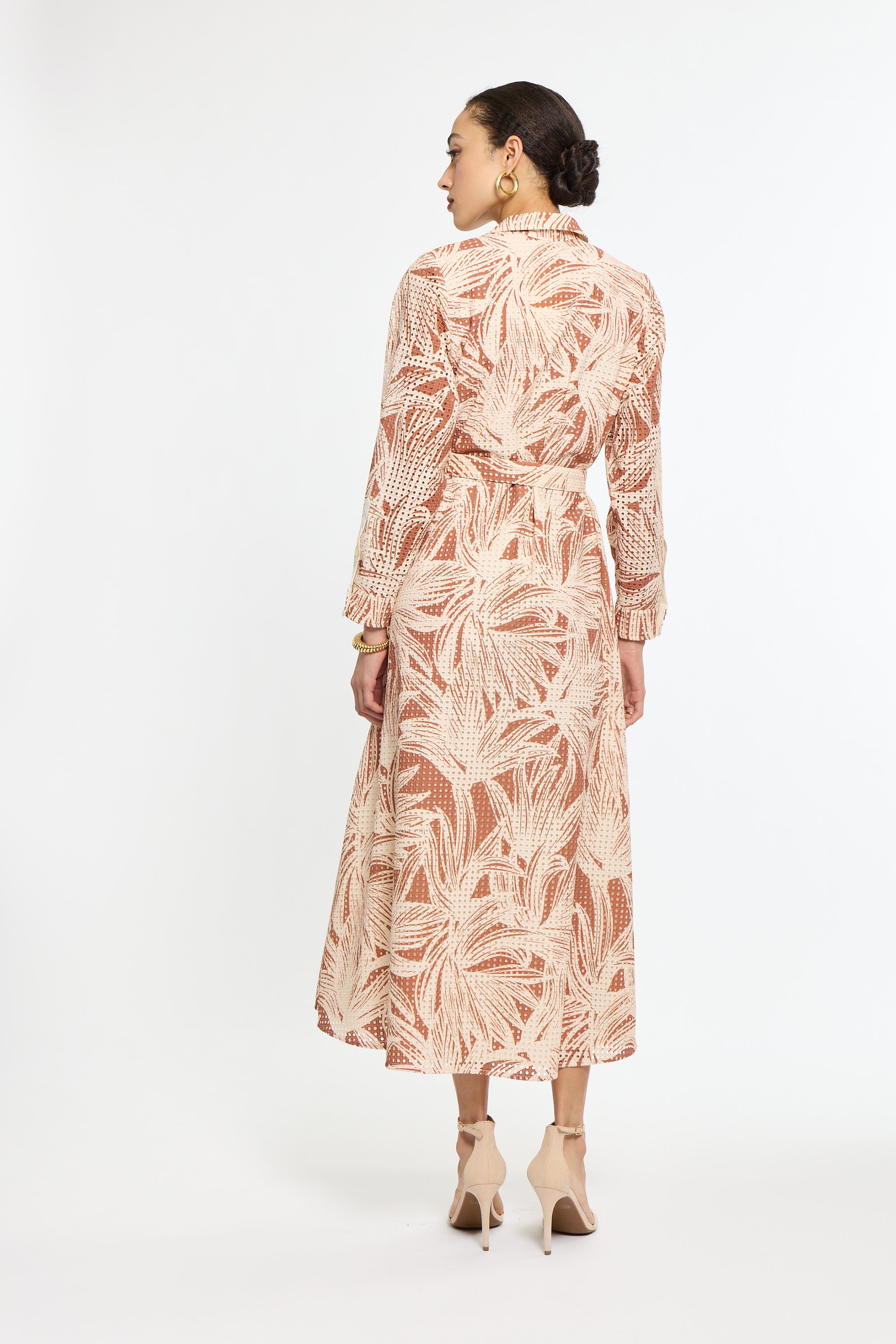 Woman wearing a floral dress on a white background