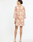 Woman wearing a floral dress on a white background