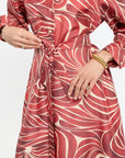 Red and white patterned dress with a white background