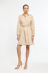 Woman wearing a beige striped dress on a white background