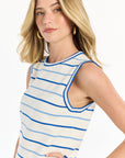 Woman wearing a white and blue striped sleeveless top on a white background