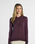 Woman wearing a purple cardigan on a white background