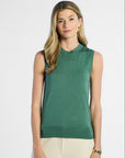 woman wearing green sleeveless silk shell against a white background
