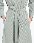 Long striped dress with a tie waist on a white background