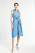 Woman modeling a sleeveless blue dress against a white background