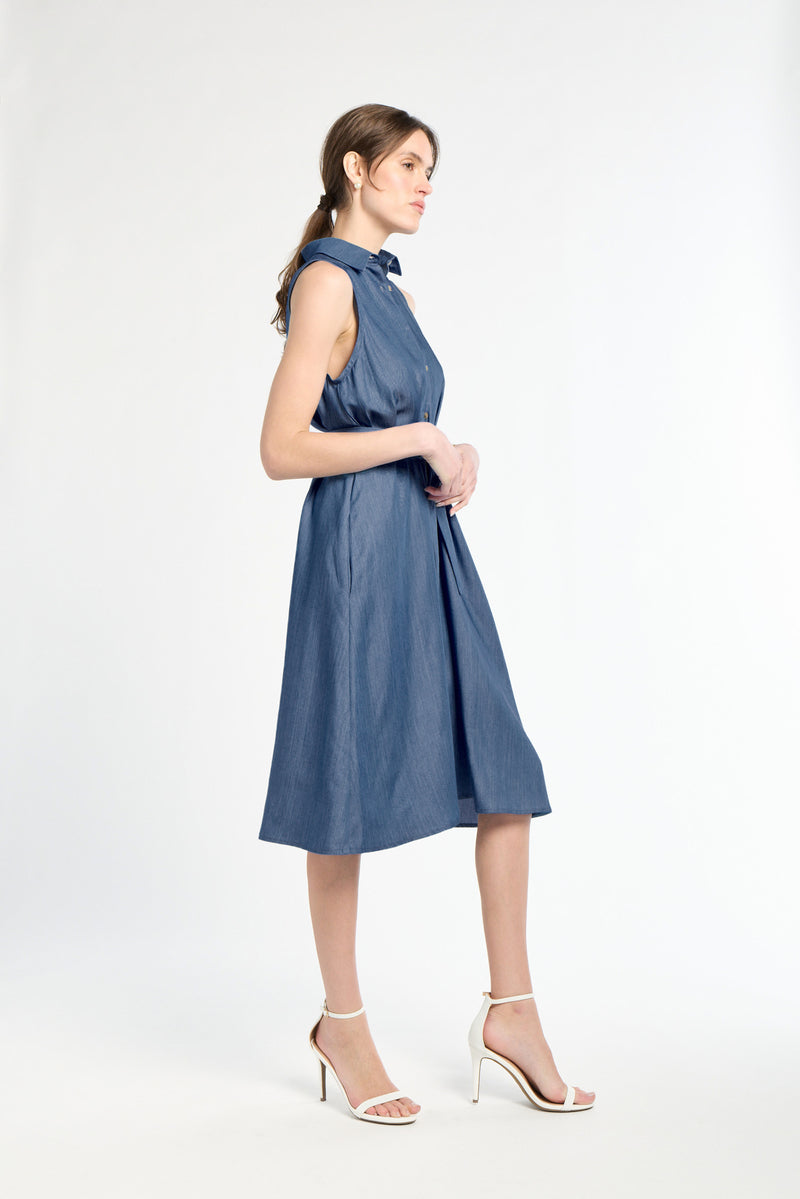 Woman wearing a blue dress on a white background