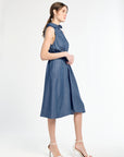 Woman wearing a blue dress on a white background
