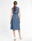 Woman wearing a blue dress on a white background