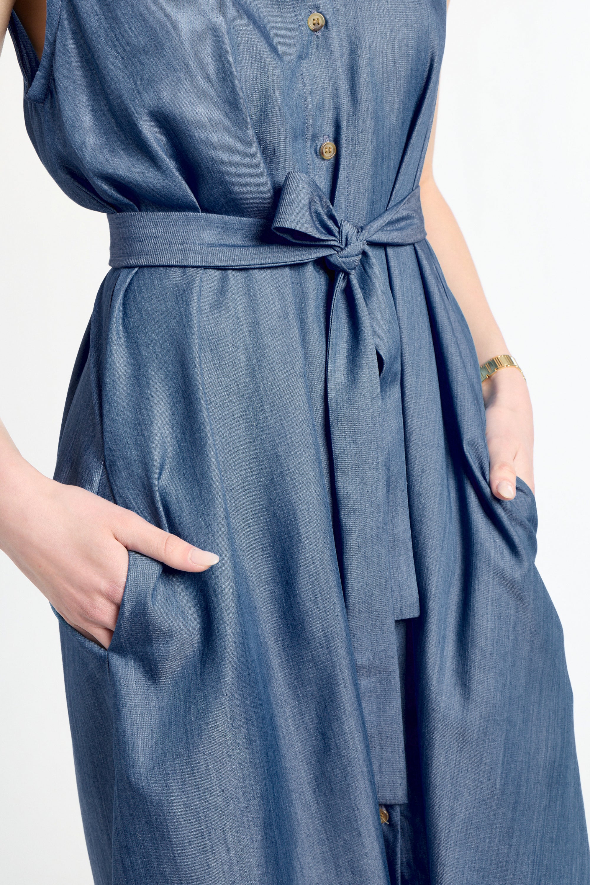 Blue dress with a tie waist on a white background