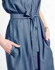 Blue dress with a tie waist on a white background