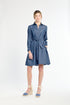 Woman wearing a blue dress on a white background