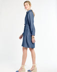 Woman wearing a blue dress on a white background