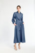 Woman wearing a blue dress on a white background