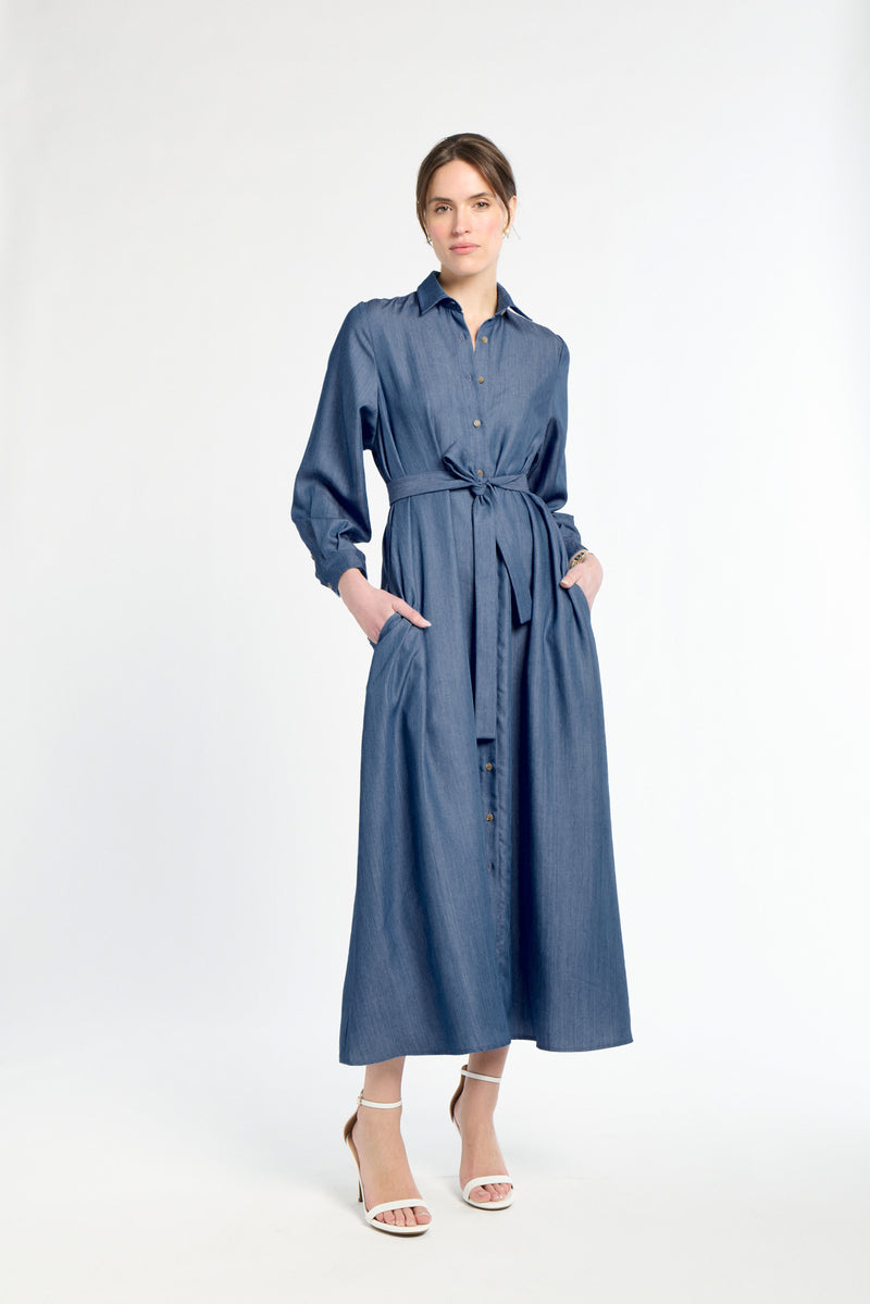 Woman wearing a blue dress on a white background